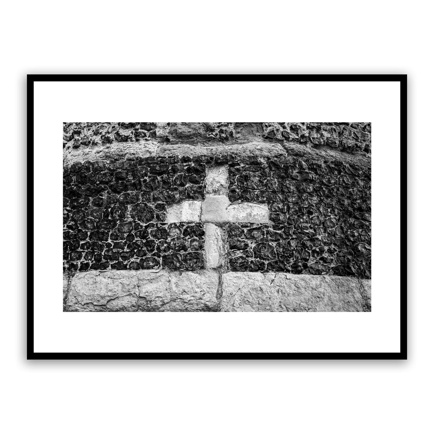 Close up section of a cross on Canterbury's ancient city wall, built by the Romans around 270 to 280 AD. Canterbury's city wall is considered one of the most magnificent in Britain. Fine art black and white photography print for sale.