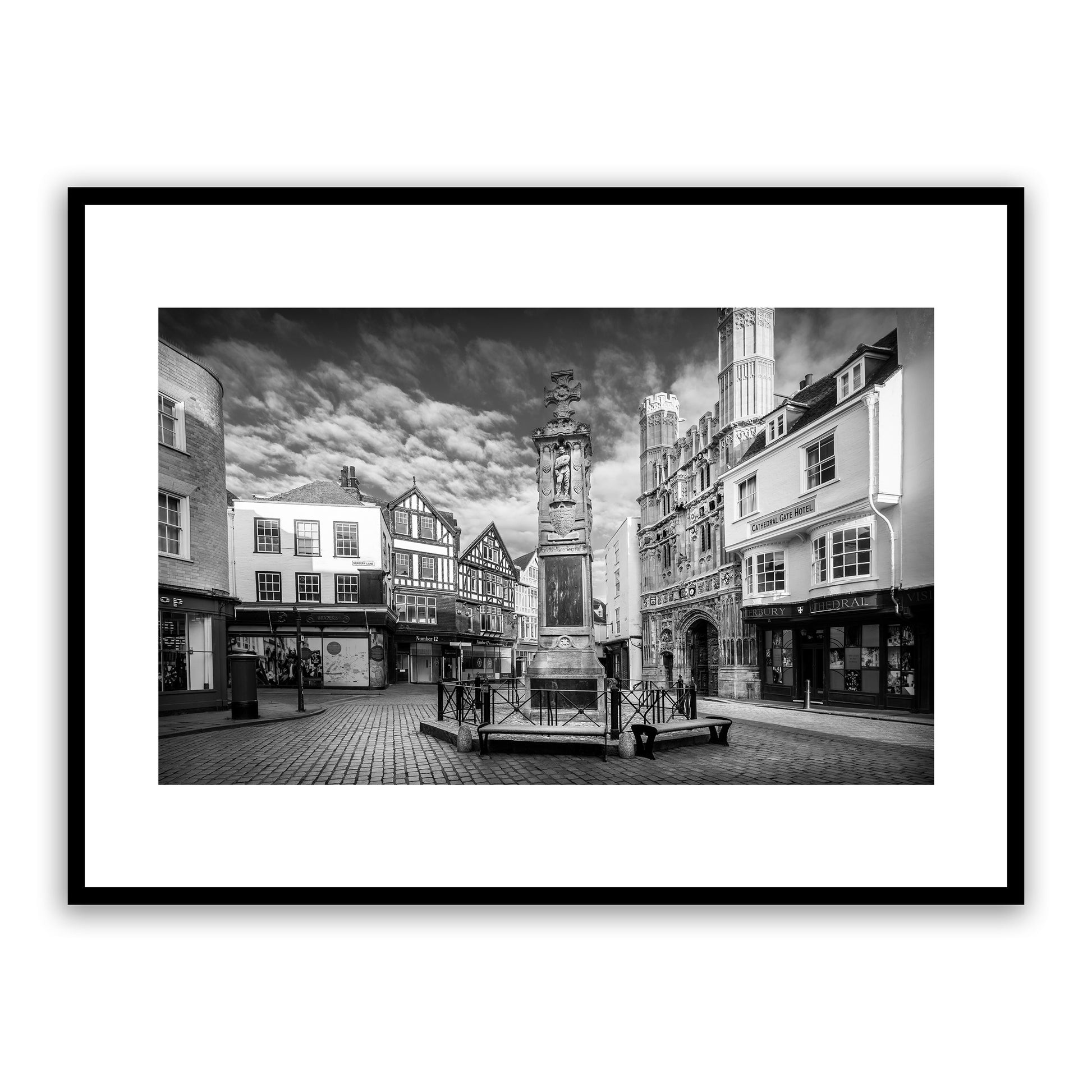 Buttermarket Square, Canterbury, Kent, England. Medieval city. Featuring the Canterbury War Memorial and Canterbury Cathedral's magnificent Christ Church Gate, Grade II listed main entrance to Cathedral precincts and scheduled ancient monument. Fine art black and white photography print for sale.