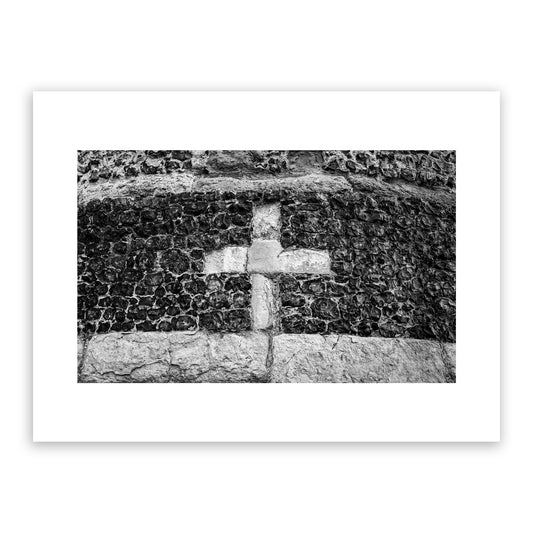 Close up section of a cross on Canterbury's ancient city wall, built by the Romans around 270 to 280 AD. Canterbury's city wall is considered one of the most magnificent in Britain. Fine art black and white photography print for sale.