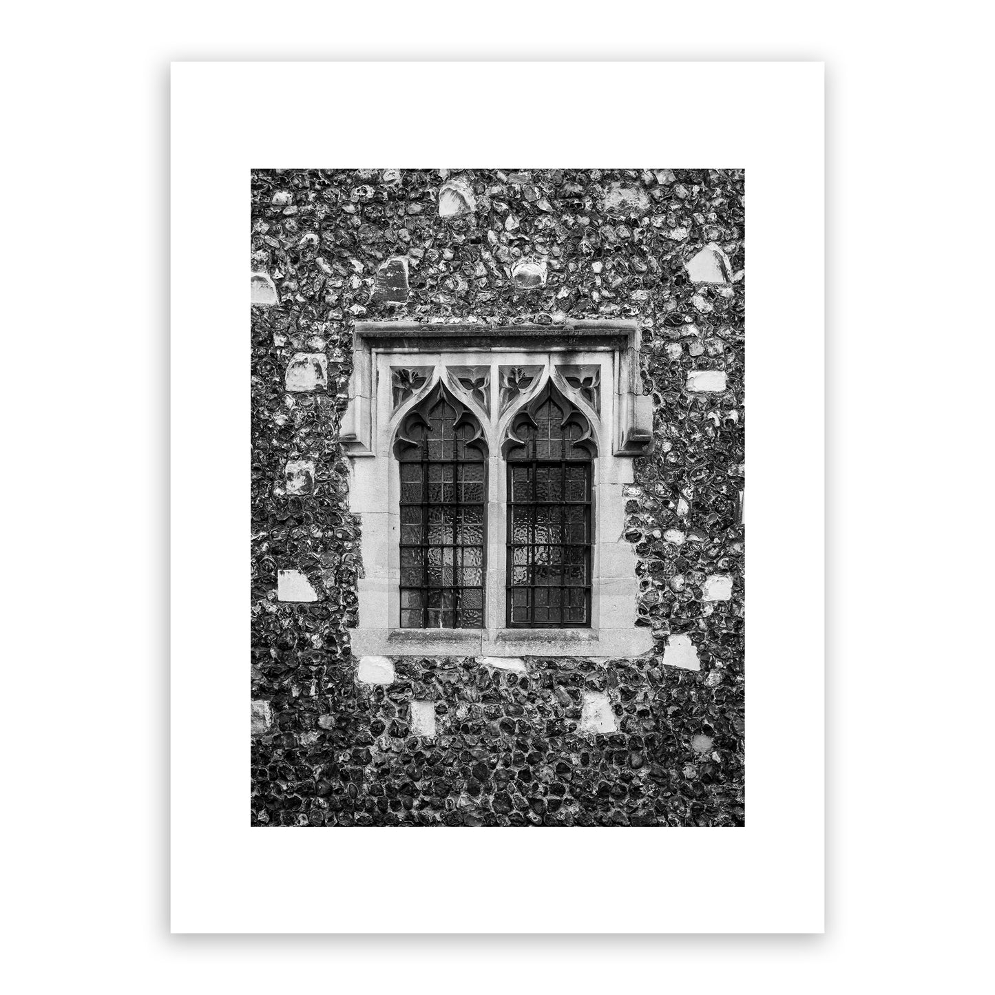 Medieval window in the Borough, the King’s Mile, Canterbury, Kent, England. Many of Canterbury's historic buildings were built in the Gothic architectural style that flourished in England from the 12th to the mid-17th century. Fine art black and white photograph for sale.