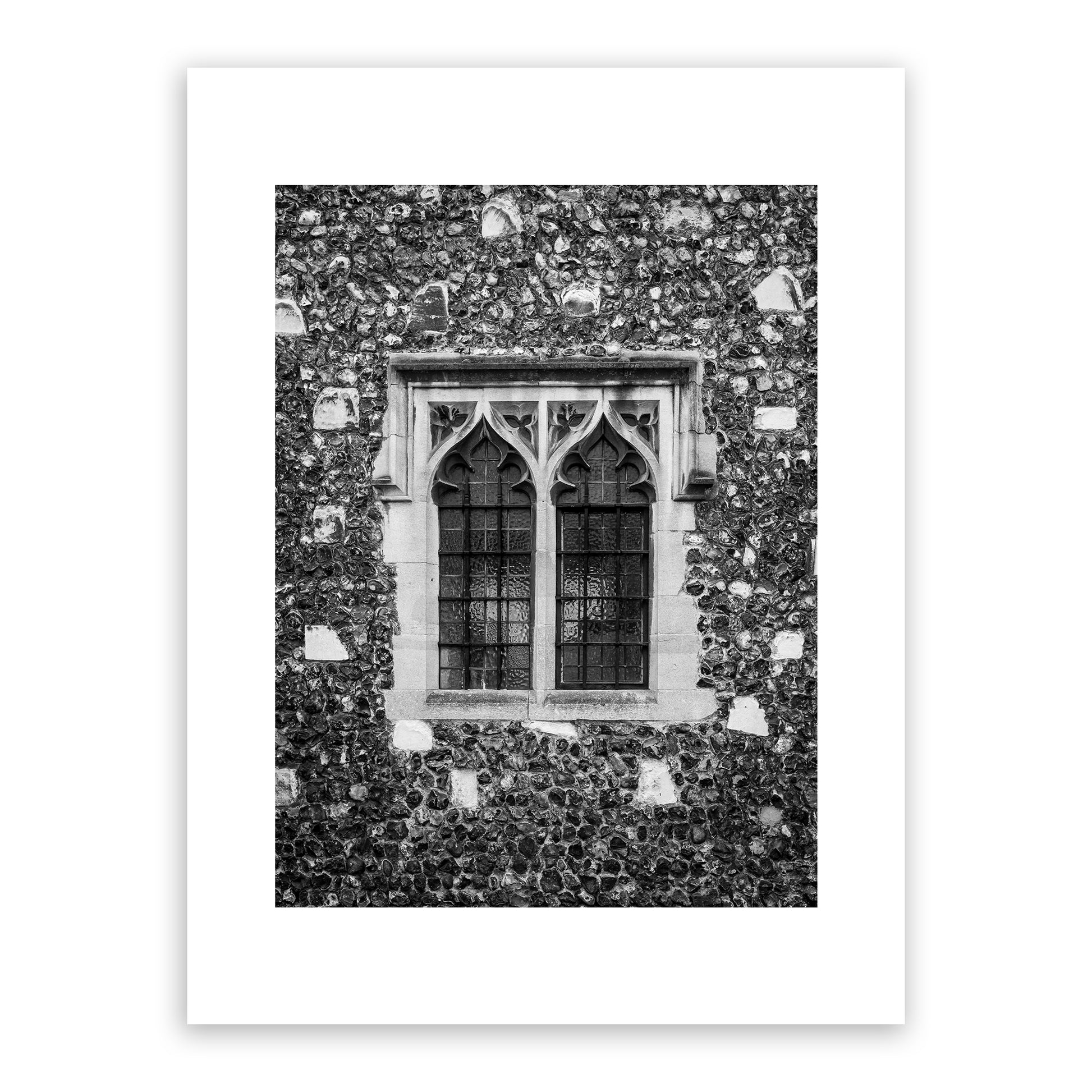 Medieval window in the Borough, the King’s Mile, Canterbury, Kent, England. Many of Canterbury's historic buildings were built in the Gothic architectural style that flourished in England from the 12th to the mid-17th century. Fine art black and white photograph for sale.