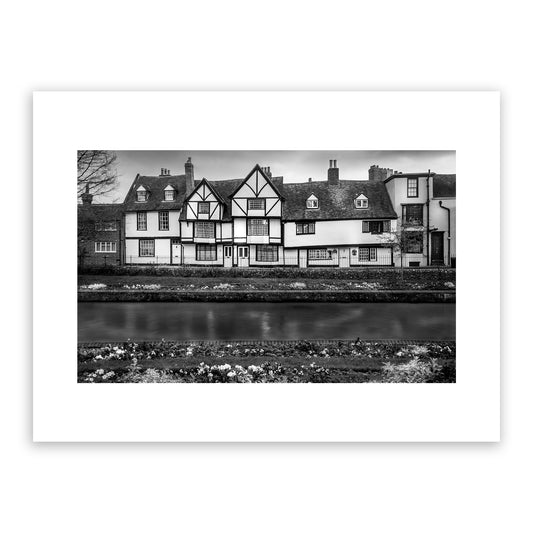 Westgate Grove on the Stour. Traditional 16th century row of houses on the banks of the river Stour seen from the beautiful Westgate Gardens, Canterbury, Kent, England. Fine art black and white photograph print for sale.